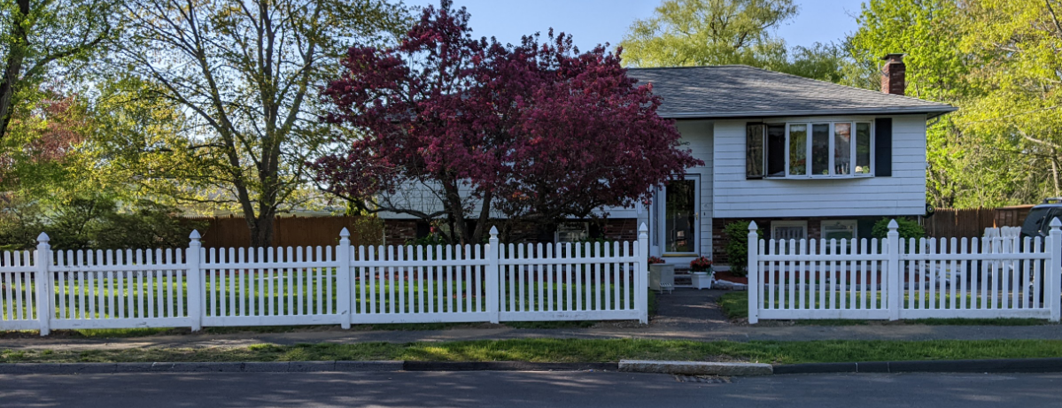 White split house with white fence